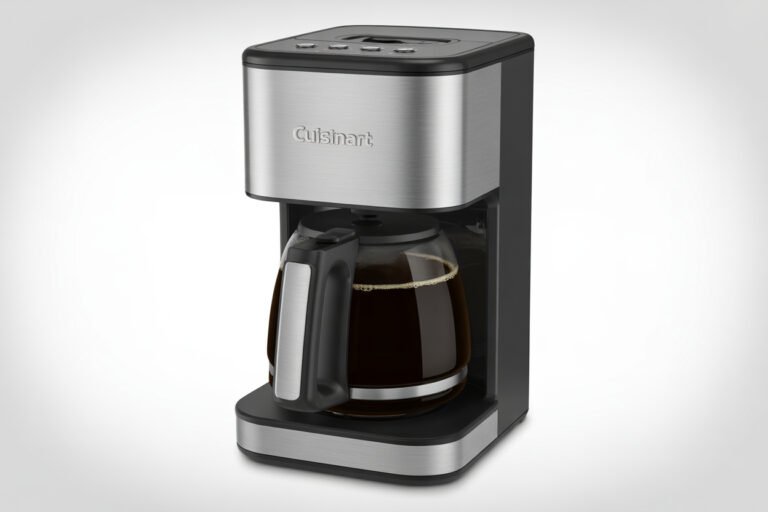 Cuisinart coffee maker with glass carafe brewing fresh coffee on kitchen counter with coffee beans and mugs